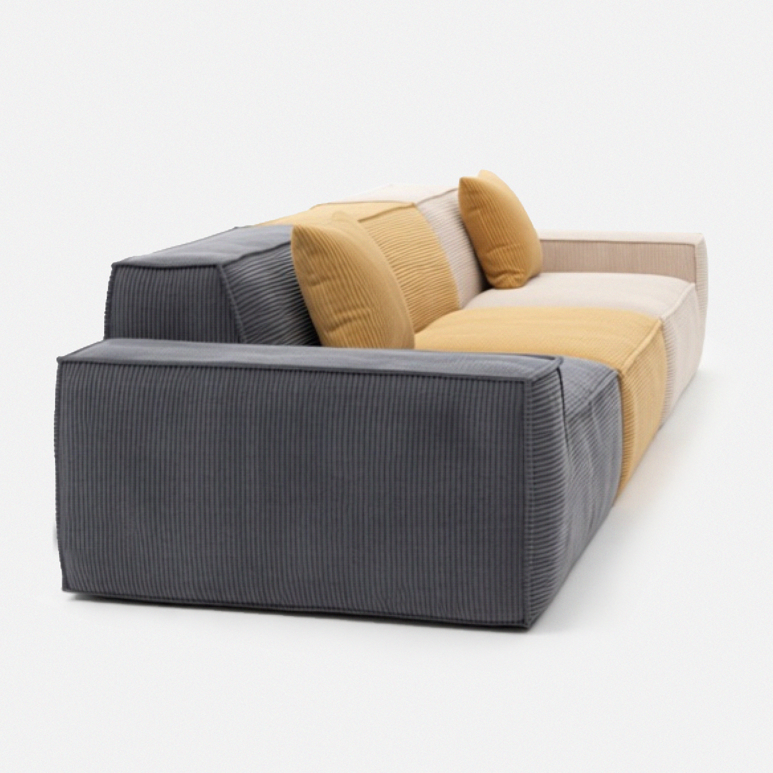 Kivo Modular Sofa shown from a rear side angle with charcoal, mustard, and cream modular sections