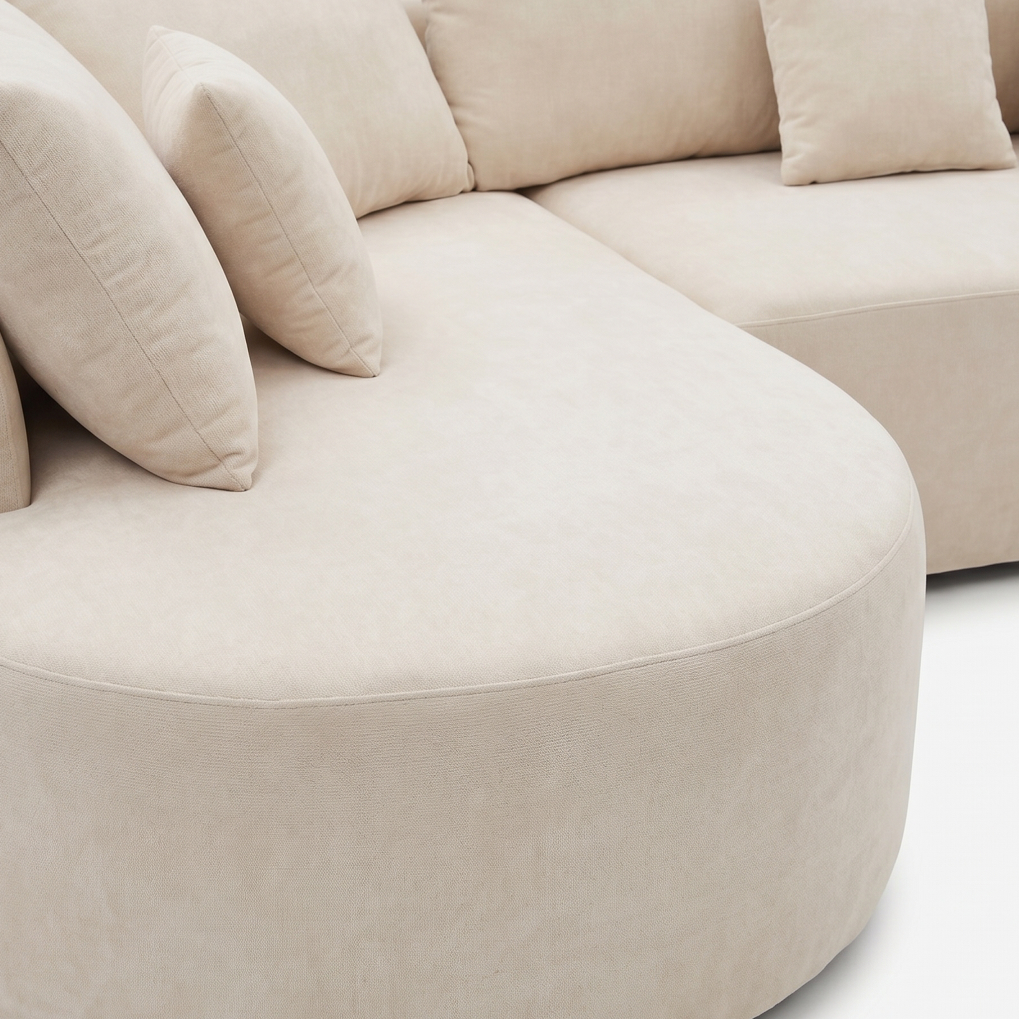 Close-up of Cove sofa curved armrest and tailored upholstery