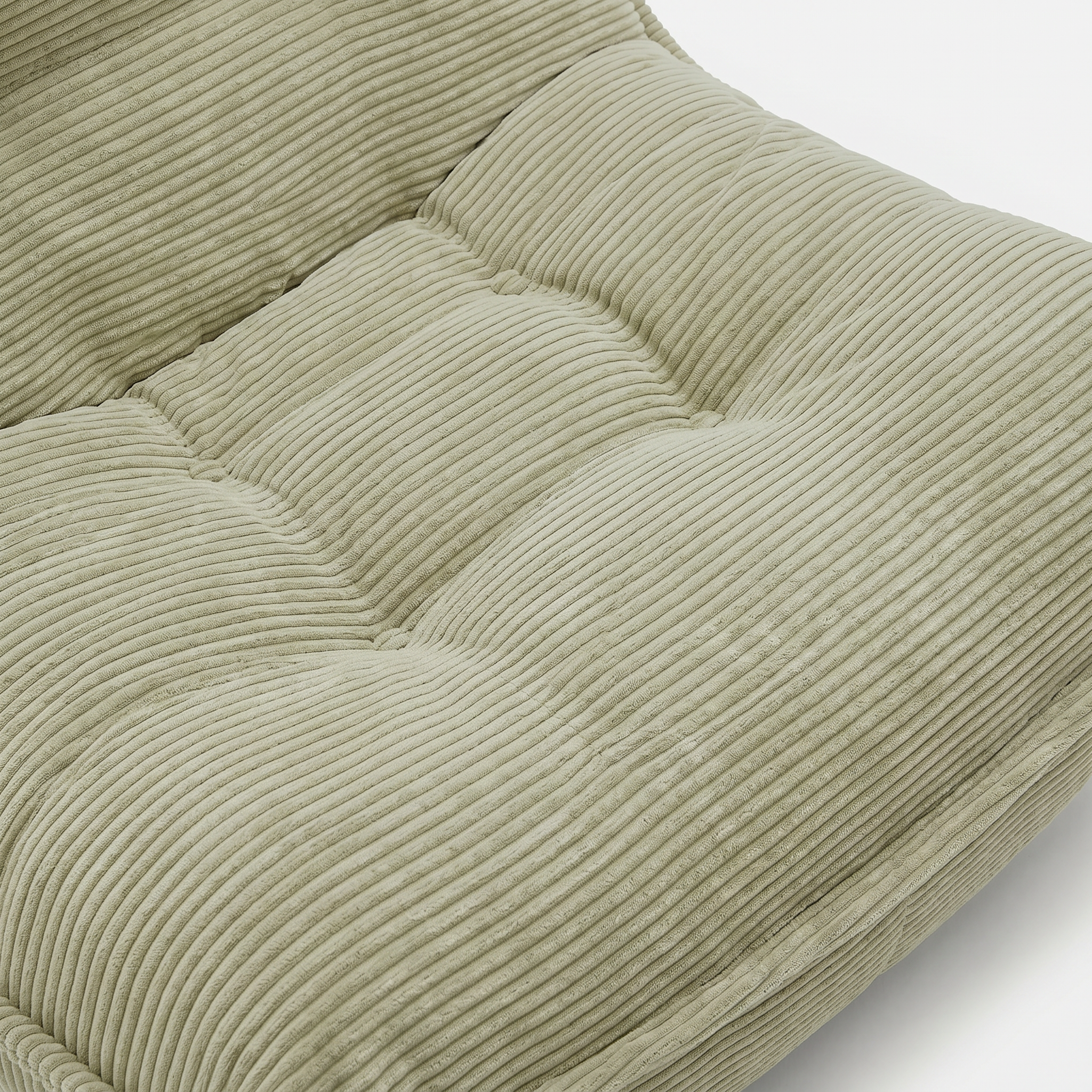 Lune Cream Lounge Chair in Moss with tufted seat and soft corduroy texture