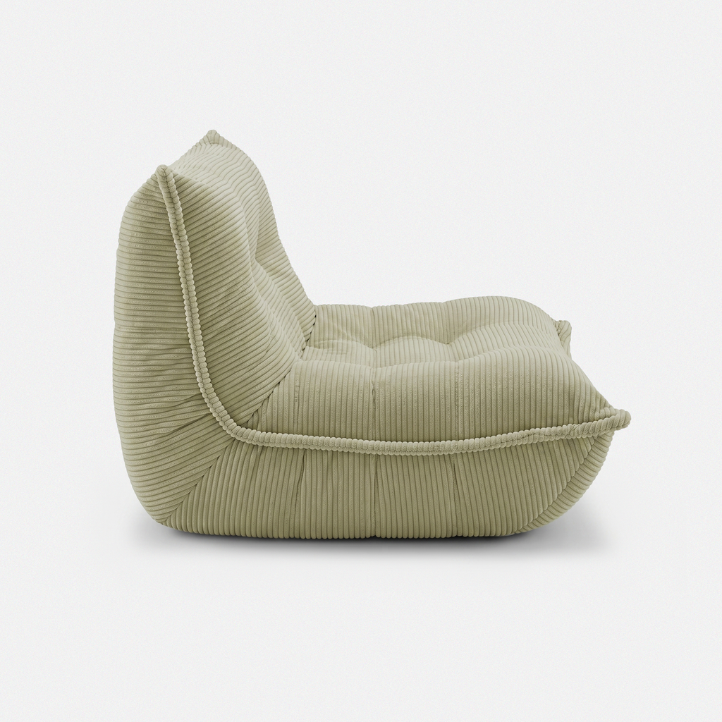 Lune Cream Lounge Chair in Moss side view with curved low-profile design