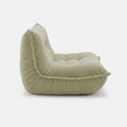 Lune Cream Lounge Chair in Moss side view with curved low-profile design