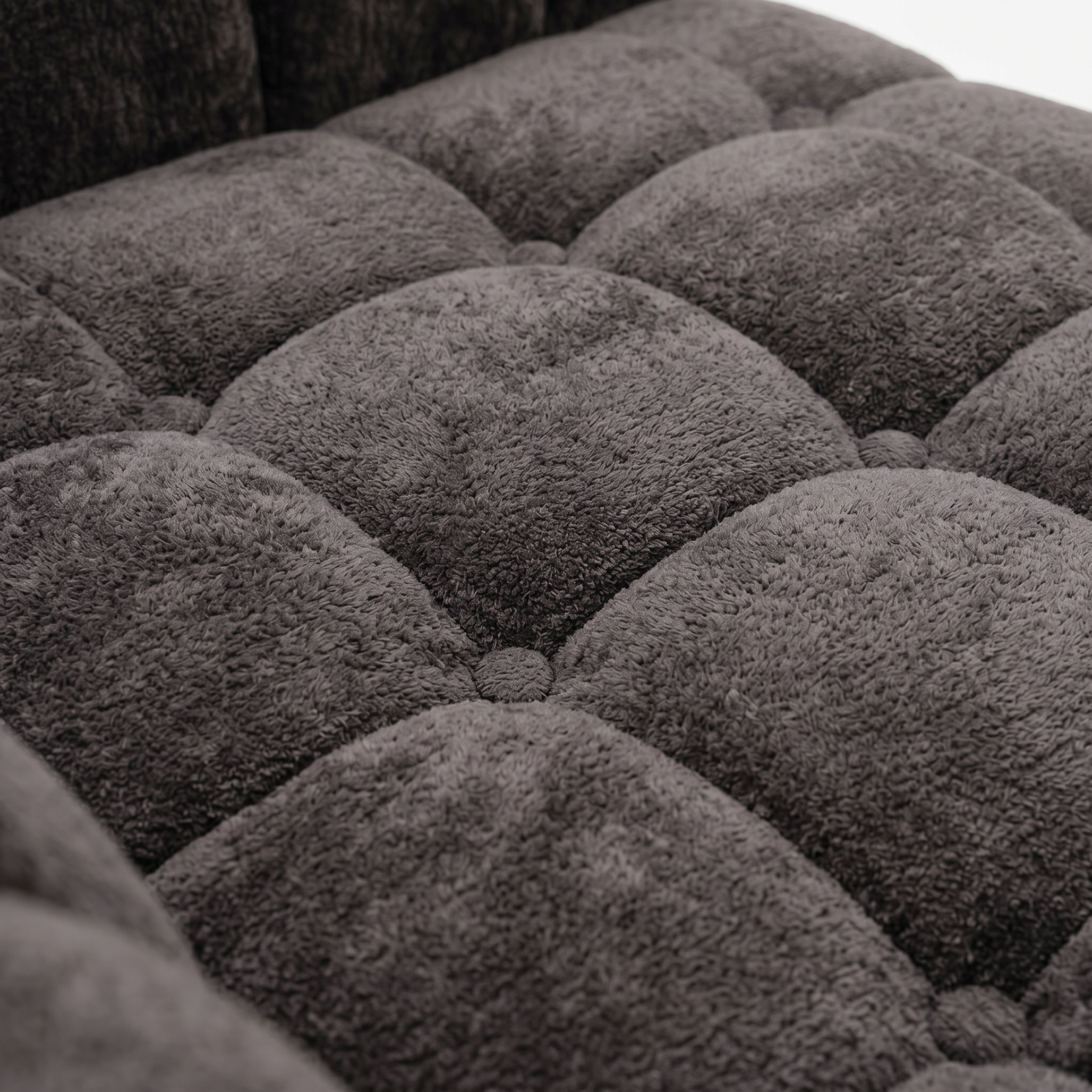 Close-up of charcoal plush corduroy fabric on Melo loveseat
