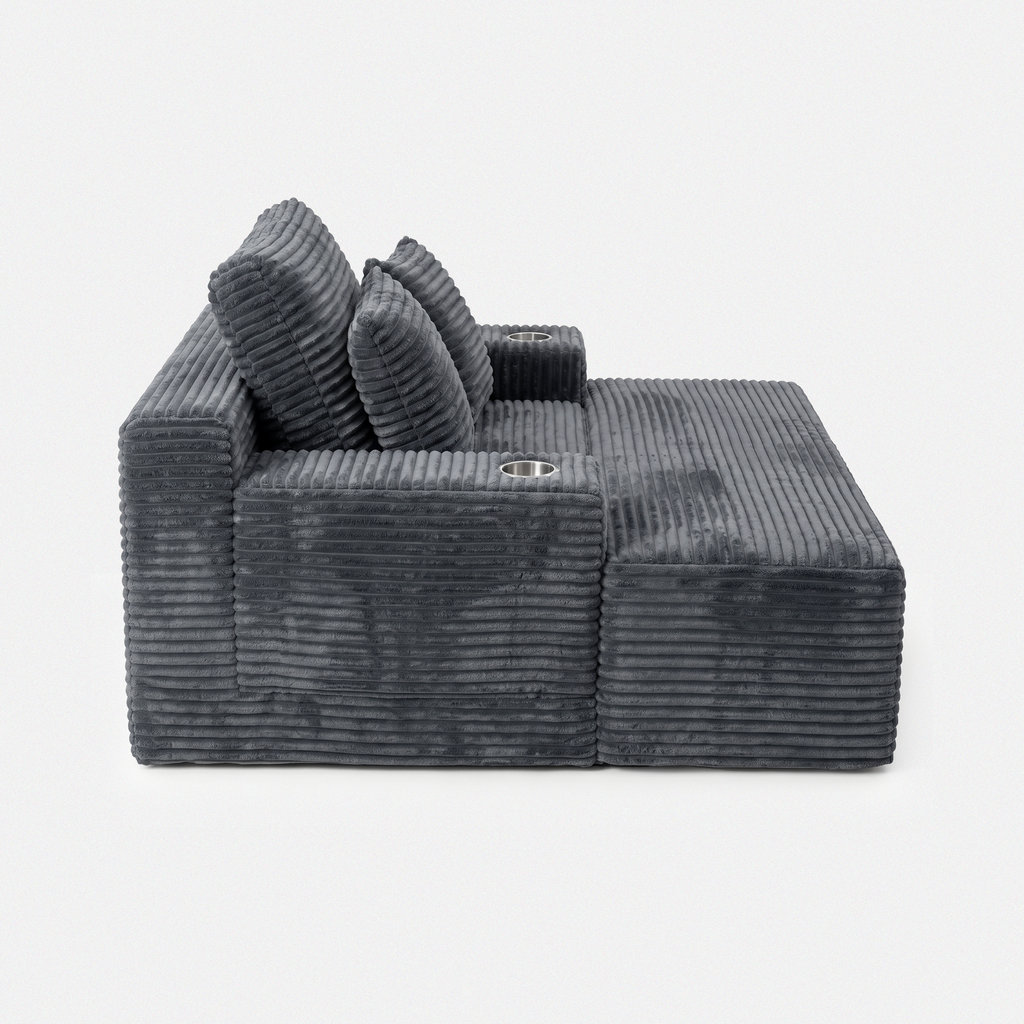 Side view of the Lune Charcoal Compact Chaise Lounge showing its deep seat, angled back cushions, and built-in cup holders