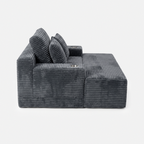 Side view of the Lune Charcoal Compact Chaise Lounge showing its deep seat, angled back cushions, and built-in cup holders