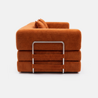 Milo Corduroy Sleeper Sofa folded view in Tangerine with metal support frame detail