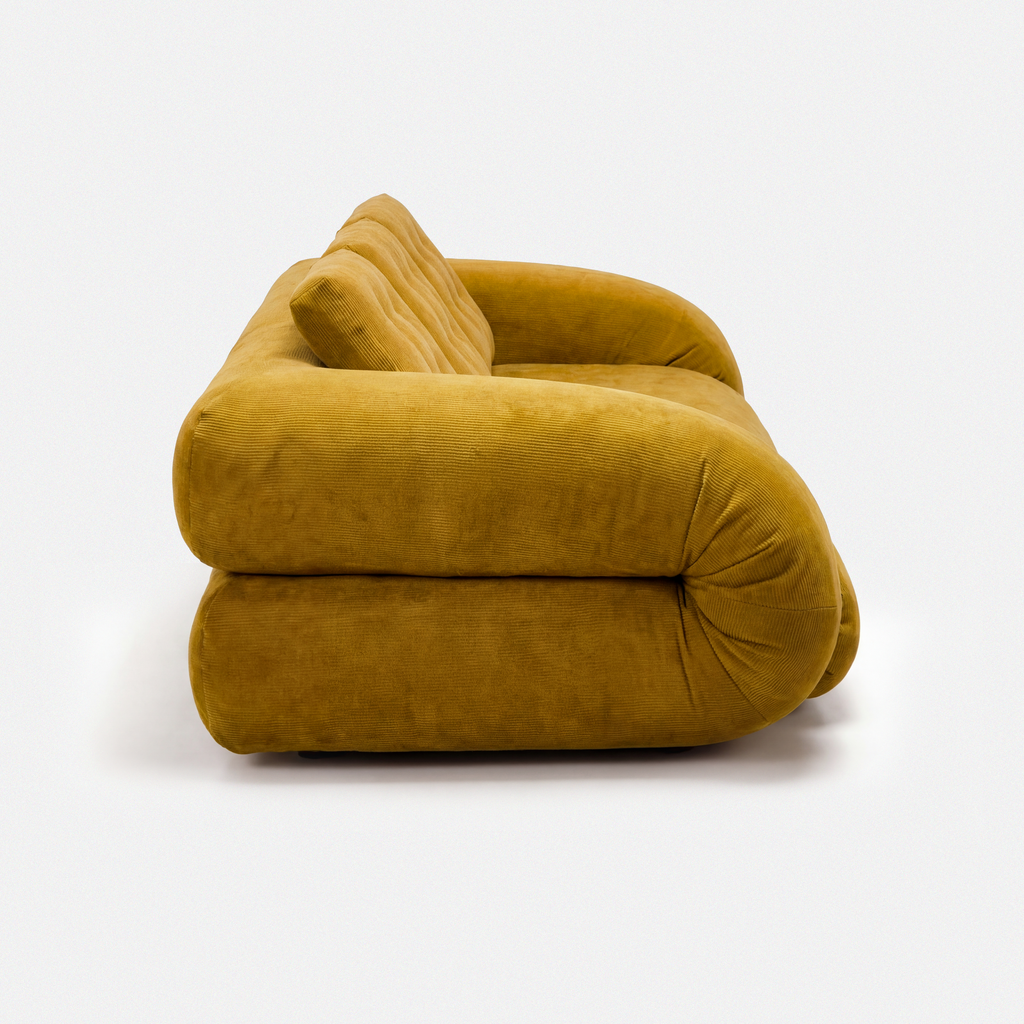 Side view of Tovo Plush Pillow Sleeper Sofa with low wide seat and soft cushions