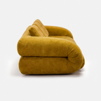 Side view of Tovo Plush Pillow Sleeper Sofa with low wide seat and soft cushions
