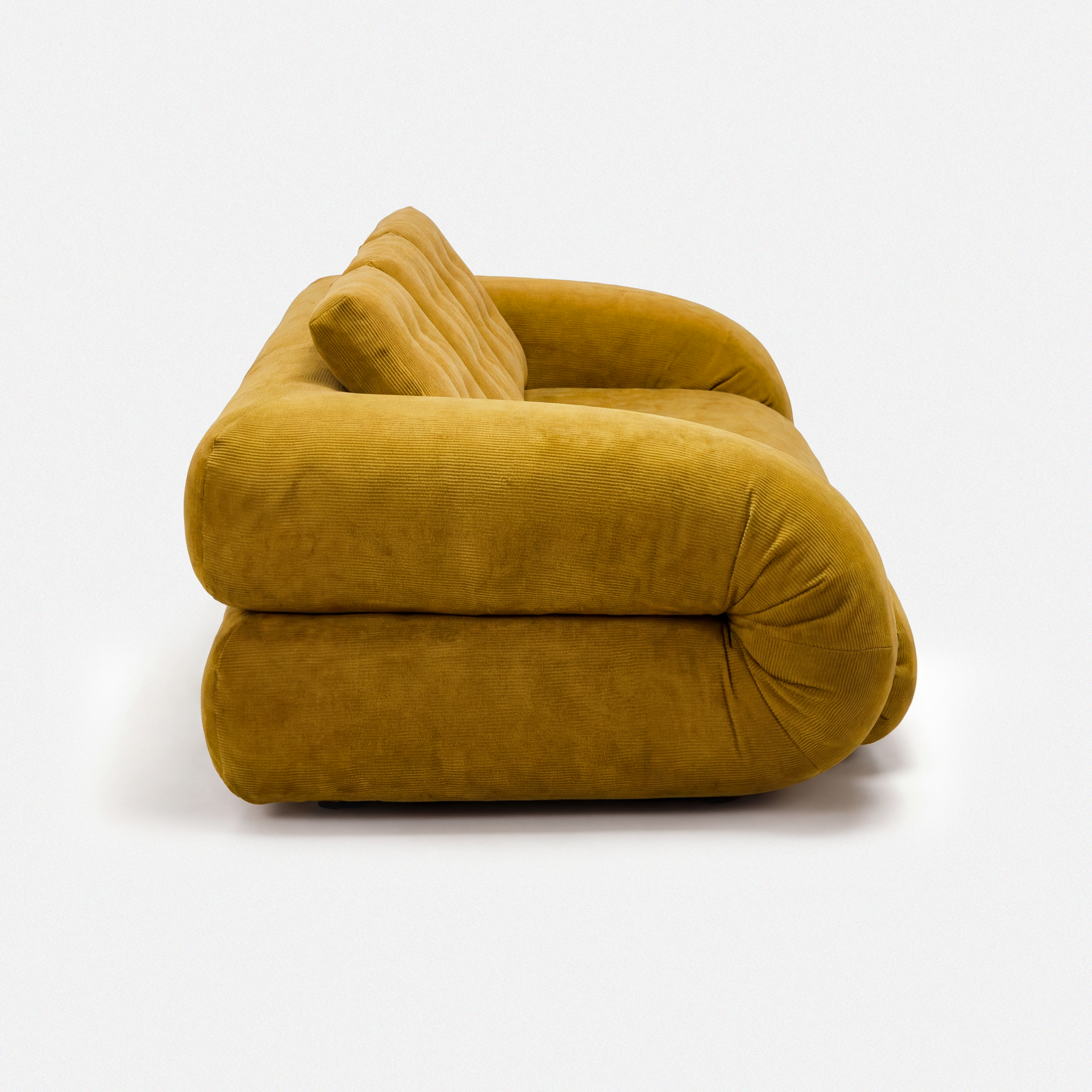Side view of Tovo Plush Pillow Sleeper Sofa with low wide seat and soft cushions