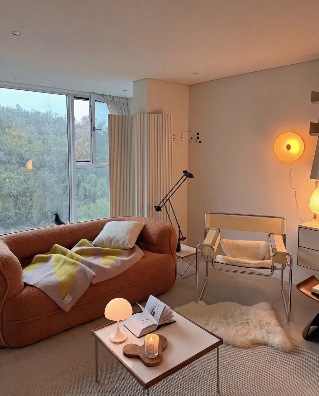Noma Curved Lounge Loveseat in Tangerine styled in a warm modern living room
