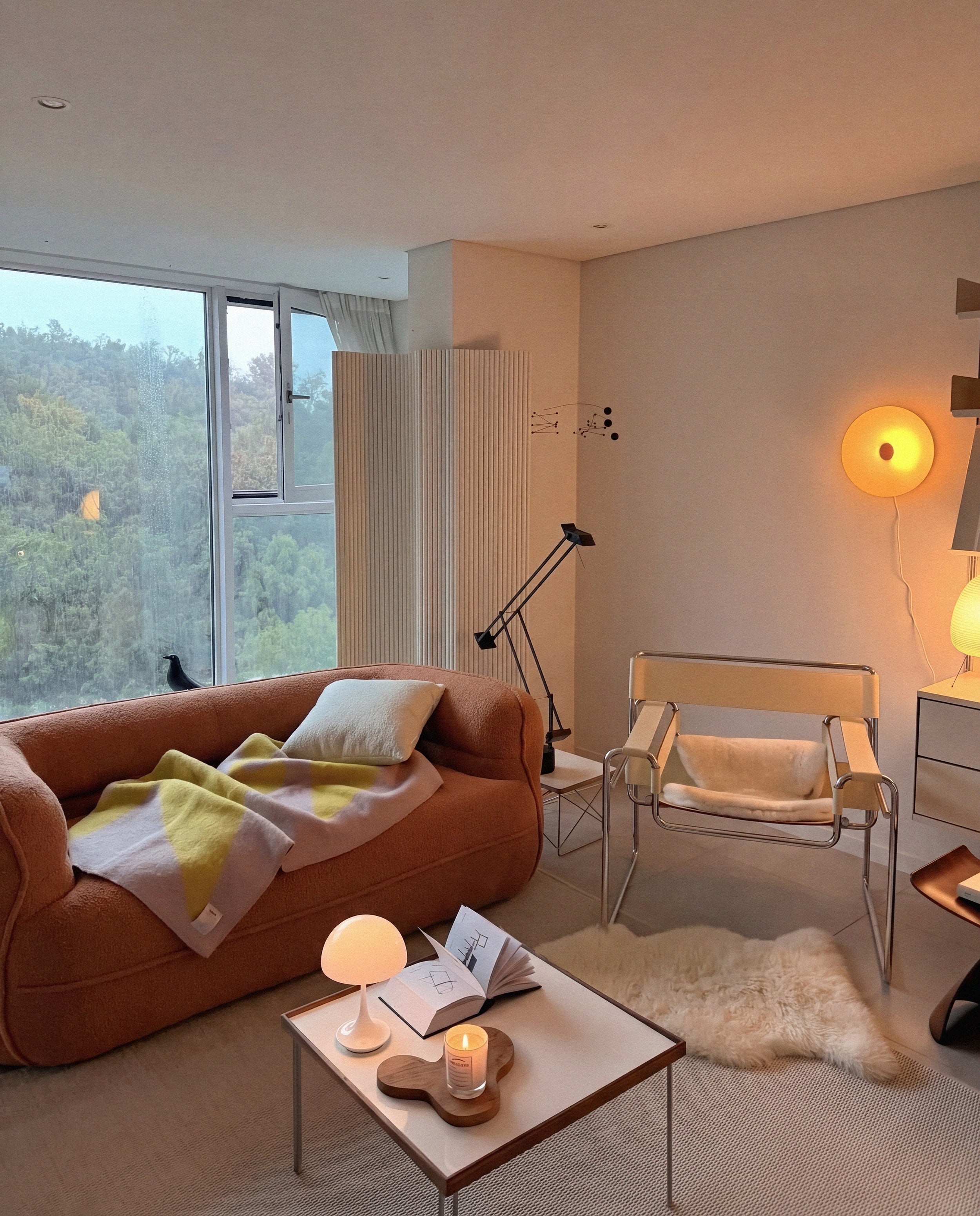 Noma Curved Lounge Loveseat in Tangerine styled in a warm modern living room