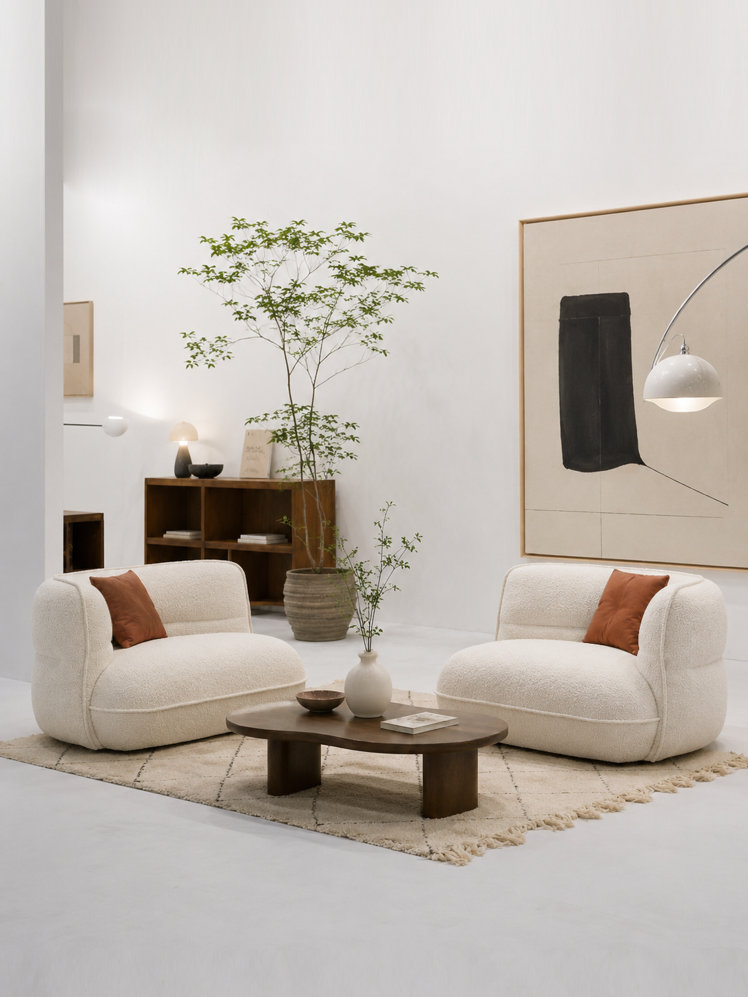 Lune Bouclé Modular Curved Sofa separated into two lounge seats in a modern living room