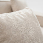 Close-up of Kivo sofa grid-tufted upholstery and soft cream white texture