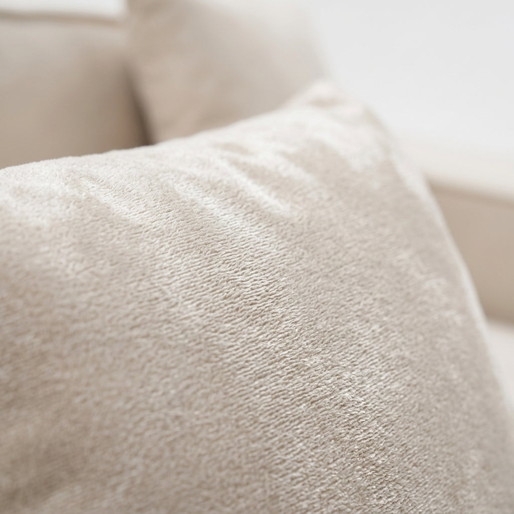 Close-up of Kivo sofa grid-tufted upholstery and soft cream white texture