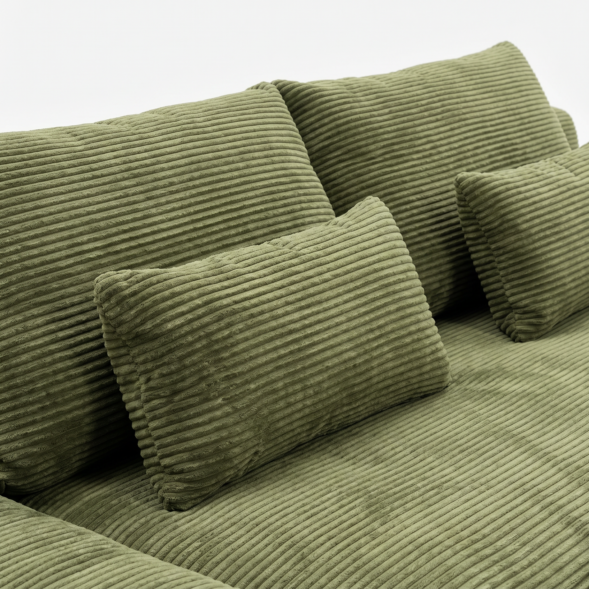 Haven Low-Profile Sleeper Sofa in Moss with plush corduroy pillows and seat detail