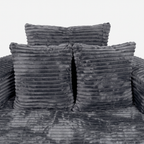 Noma Charcoal Deep Lounge Chair front detail with layered pillows and soft corduroy seat