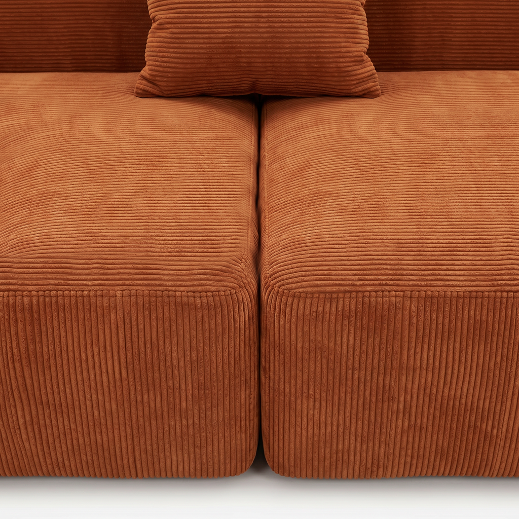 Burnt orange corduroy seat cushion and pillow detail on Plush Accent Lounge Loveseat