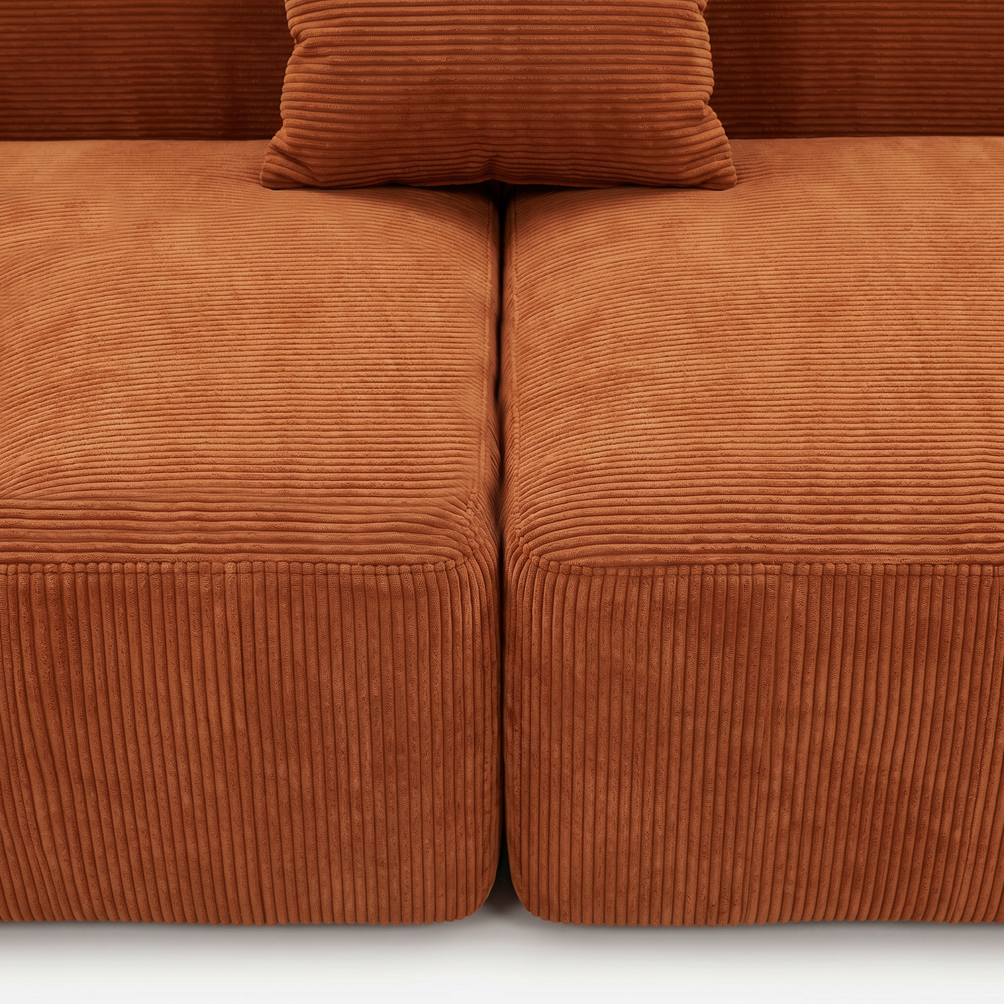 Burnt orange corduroy seat cushion and pillow detail on Plush Accent Lounge Loveseat