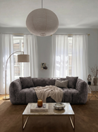Melo Charcoal Plush Loveseat styled in a modern living room
