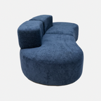 Side view of Casia Navy Wave Lounge Sofa with curved back and deep seat