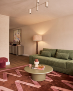 Haven Low-Profile Sleeper Sofa in Moss styled in a warm modern living room