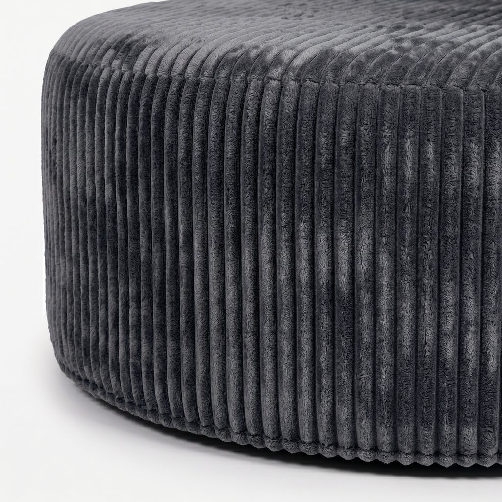 Noma Charcoal Deep Lounge Chair rounded base detail with plush ribbed corduroy upholstery