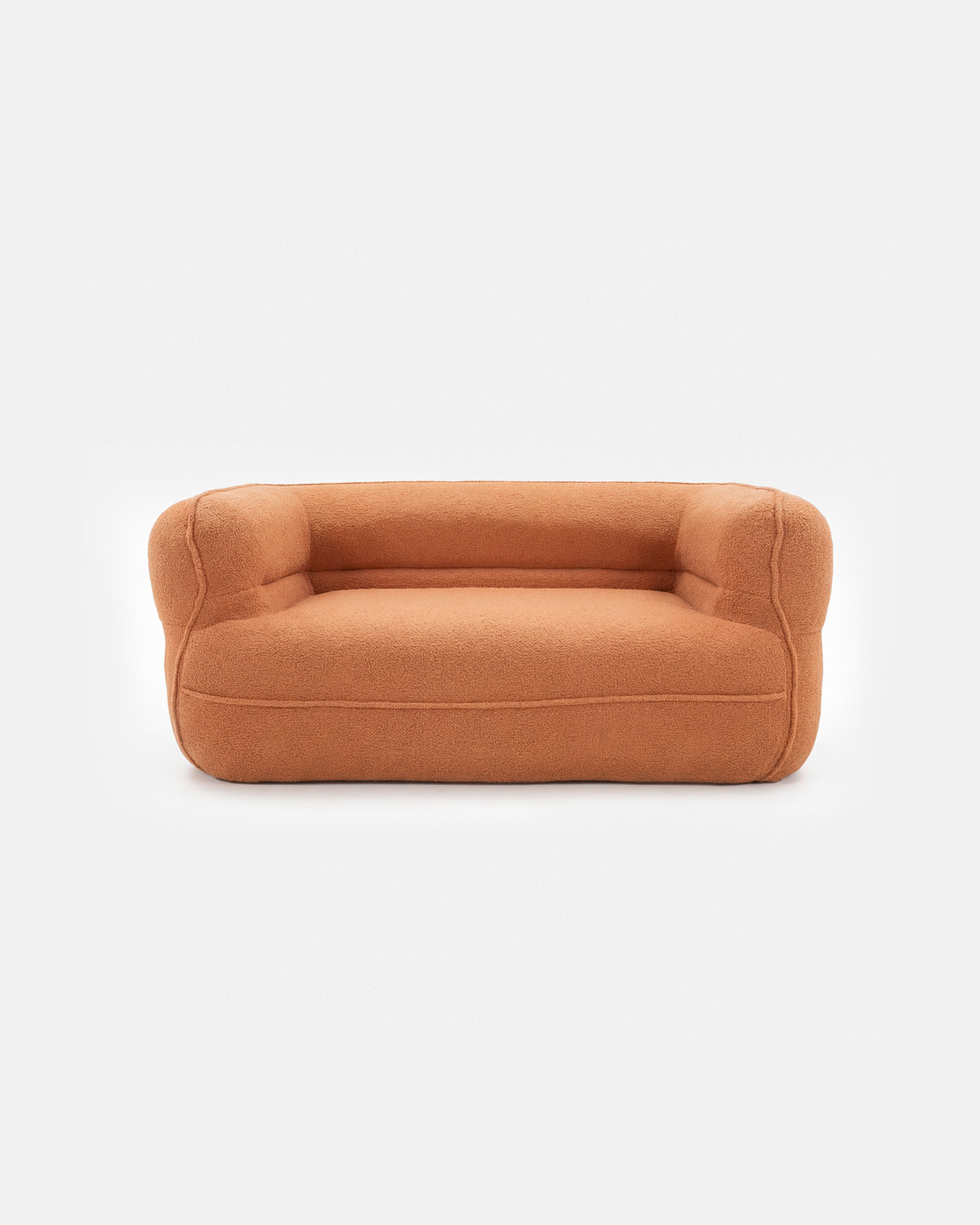 Tangerine plush sofa with rounded arms on a white background