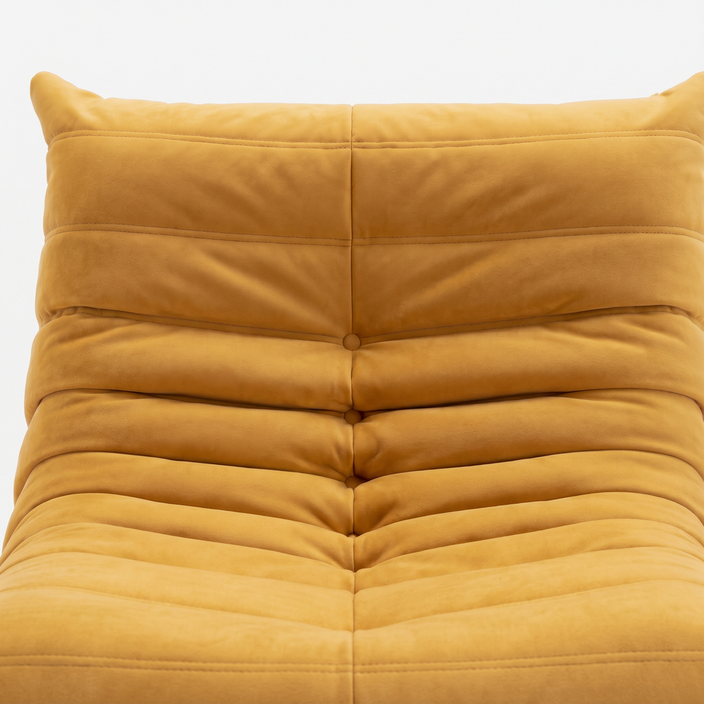 Noma Floor Lounge Chair close-up showing tufted backrest and soft yellow upholstery