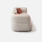 Lune Bouclé Modular Curved Sofa side view with rounded armrest and cream white textured upholstery