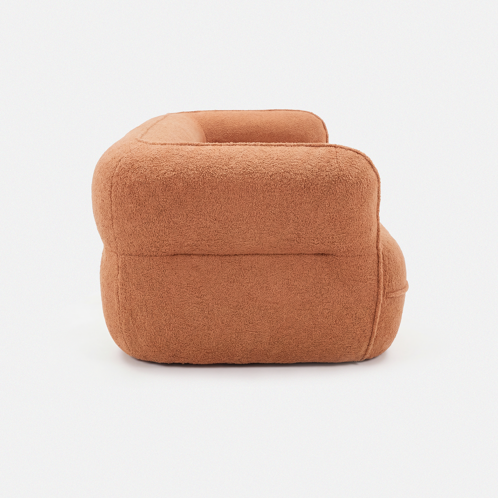 Noma Curved Lounge Loveseat in Tangerine side view with rounded armrest design