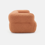 Noma Curved Lounge Loveseat in Tangerine side view with rounded armrest design