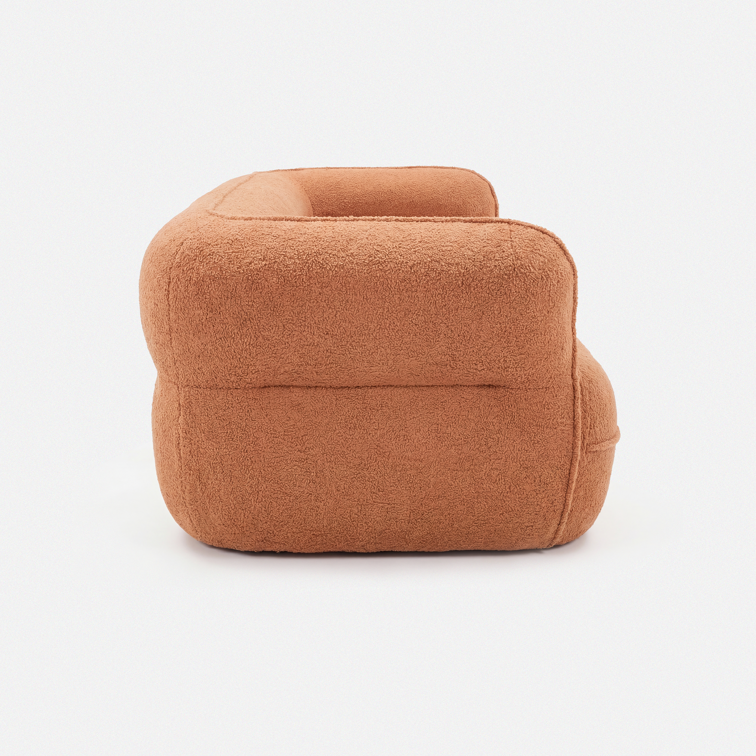 Noma Curved Lounge Loveseat in Tangerine side view with rounded armrest design