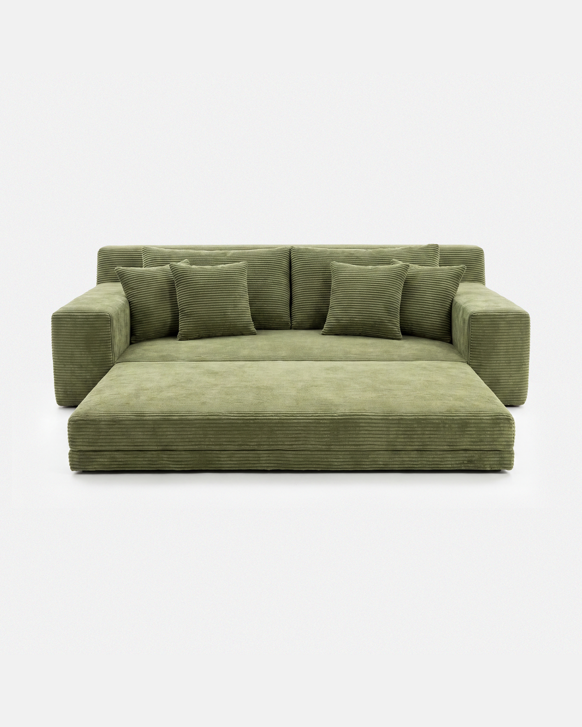Forest green modular sofa bed with chaise and coordinating pillows on a white background