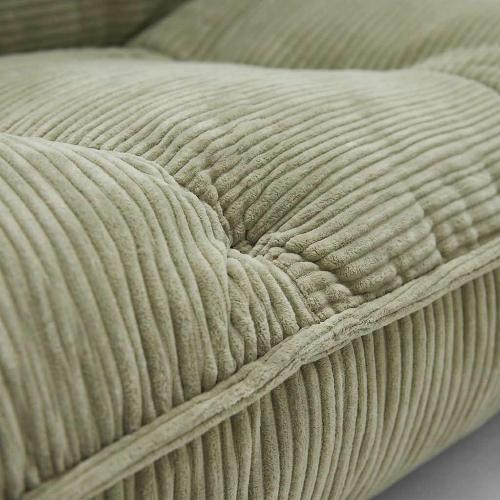 Lune Cream Lounge Chair in Moss with plush corduroy seat and seam detail