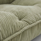 Lune Cream Lounge Chair in Moss with plush corduroy seat and seam detail