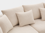 Cove Curved Sleeper Sofa cushion and pillow detail with soft cream upholstery