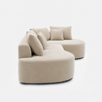 Cove Curved Sleeper Sofa side view with soft curved silhouette and cream upholstery