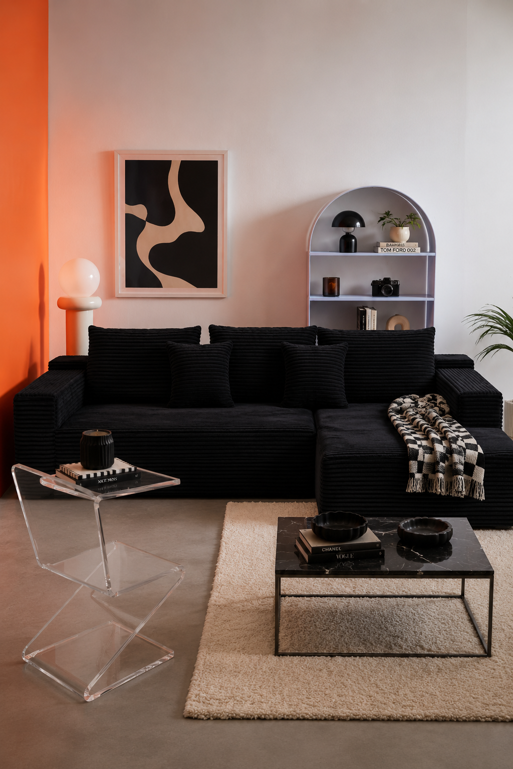 Lune Corduroy L-Shape Sectional Sofa in Black styled in a modern living room with abstract wall art
