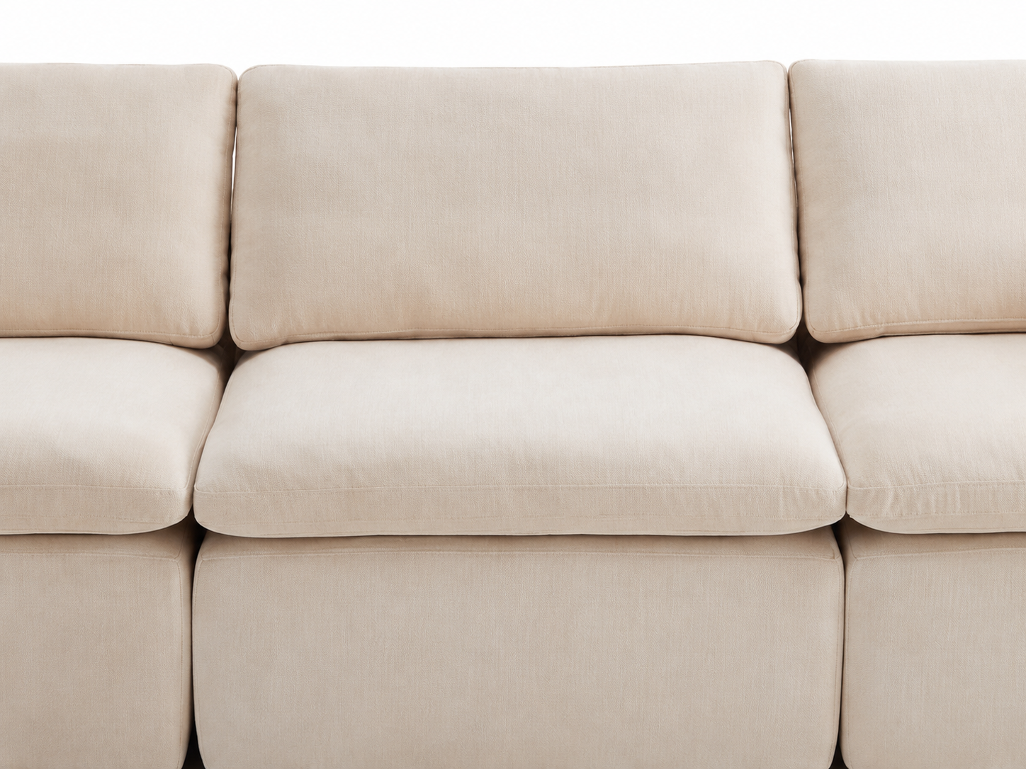 Front detail of Aero modular sectional sofa with soft back cushions and wide seat design