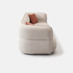 Lune Bouclé Modular Curved Sofa side view with rounded armrest and cream white textured upholstery
