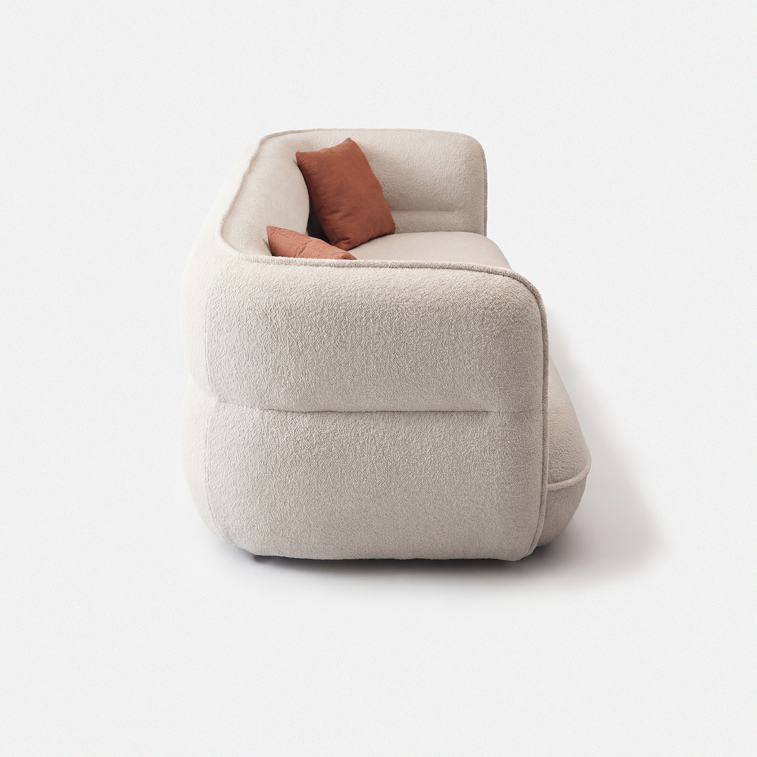 Lune Bouclé Modular Curved Sofa side view with rounded armrest and cream white textured upholstery
