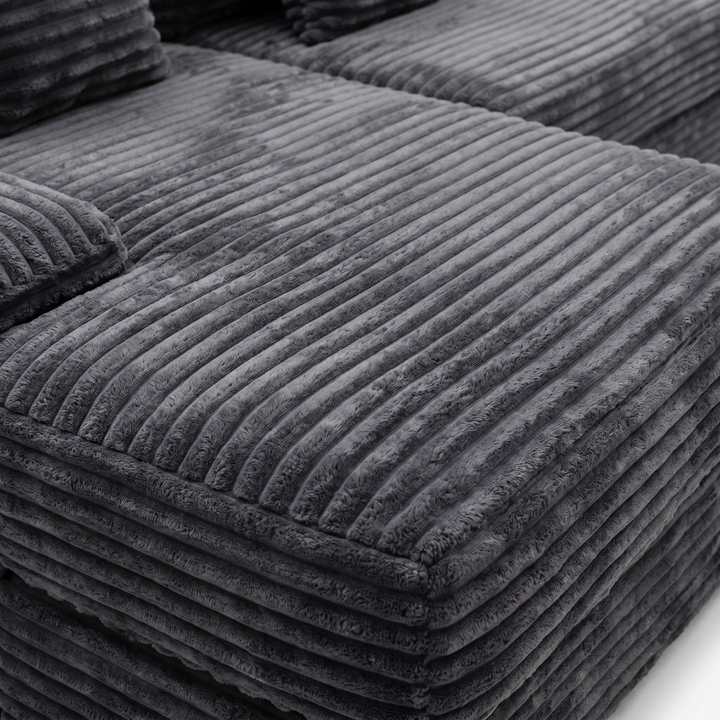 Close-up of charcoal plush corduroy fabric on Rumi sectional sofa