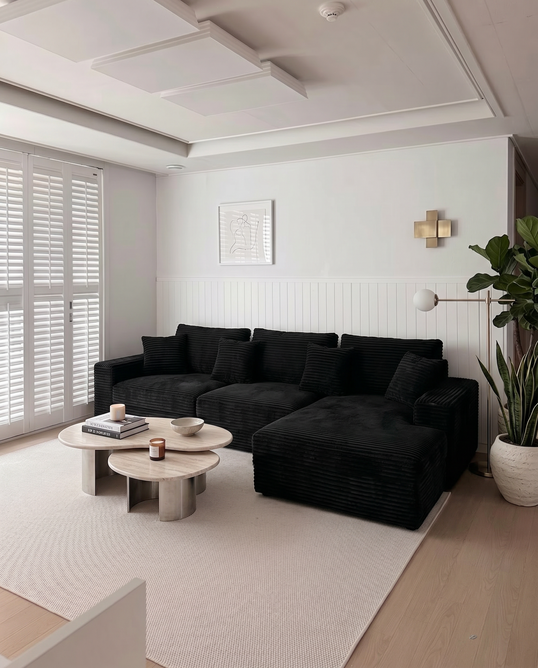 Black L-shape sectional sofa made for guests and relaxed everyday lounging