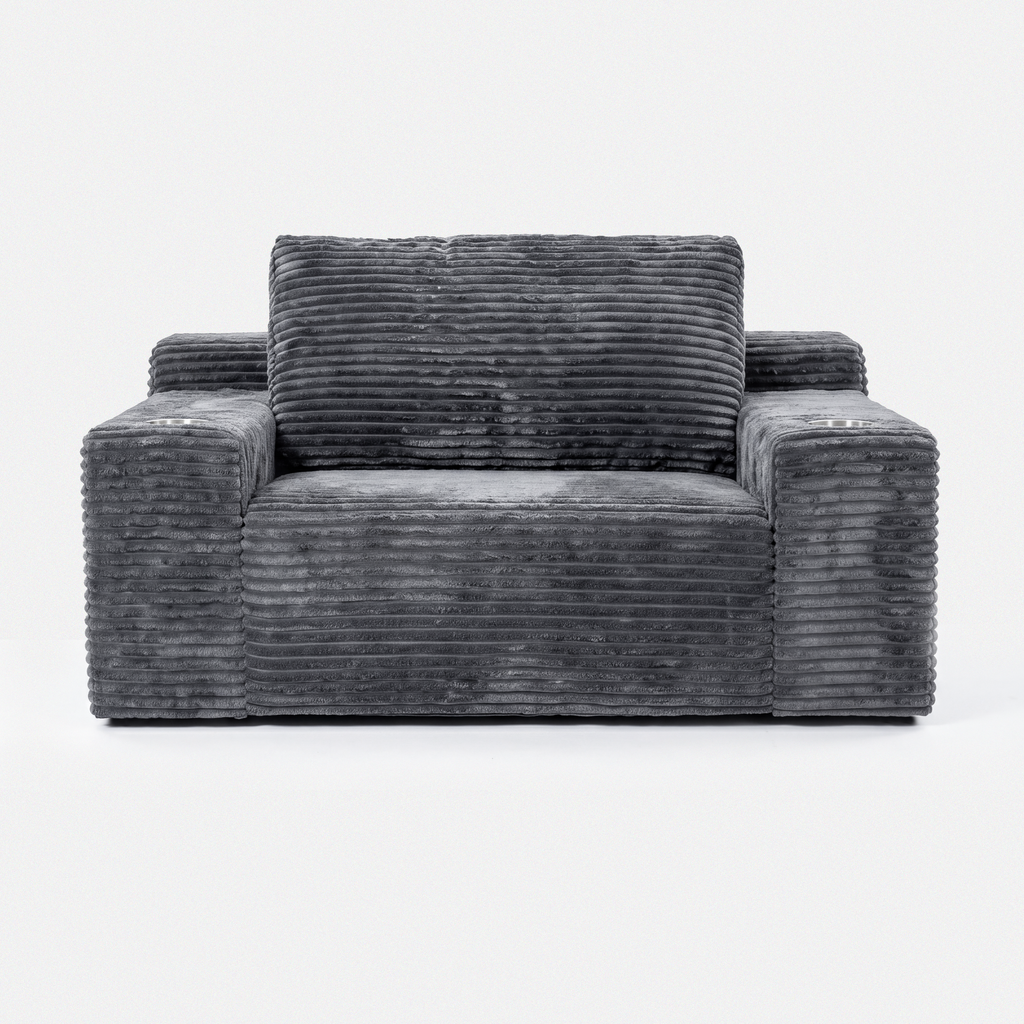Side view of the Lune Charcoal Compact Chaise Lounge showing its deep seat, angled back cushions, and built-in cup holders