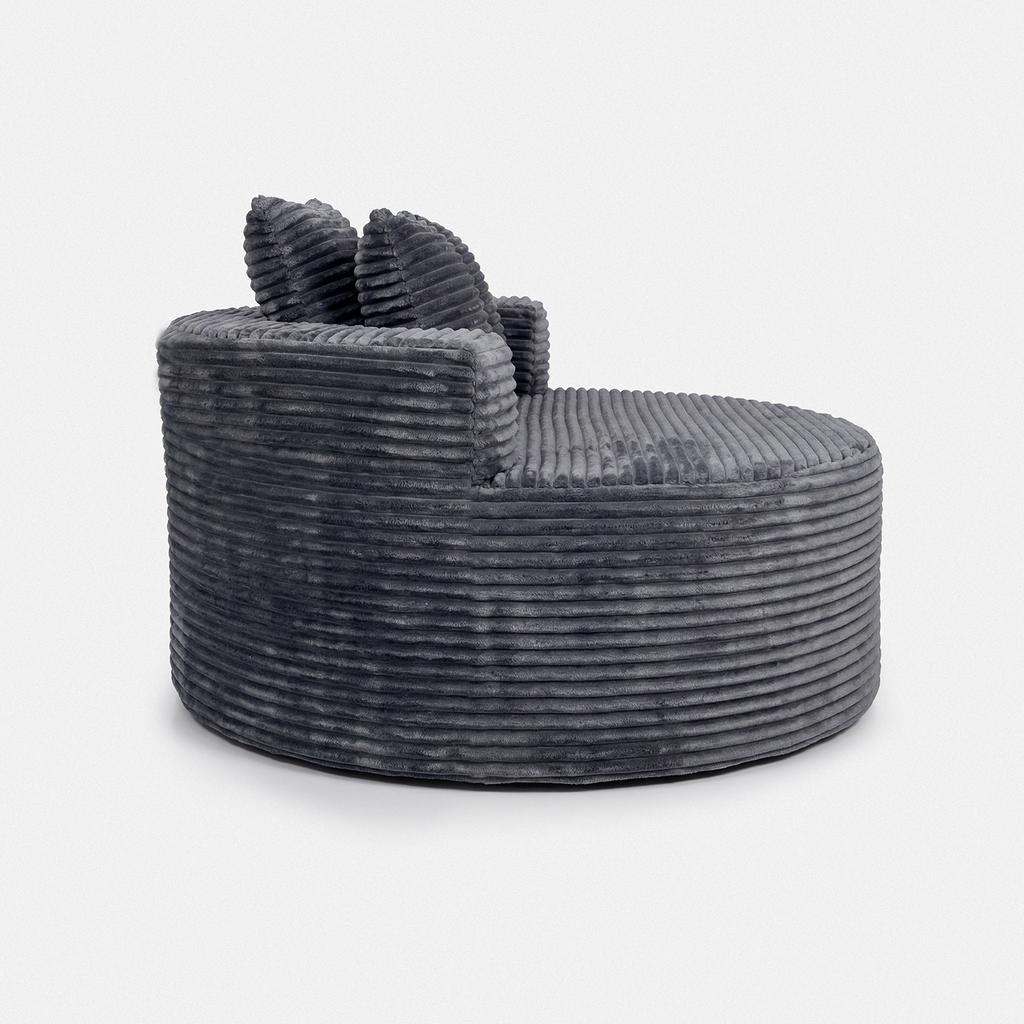 Noma Charcoal Deep Lounge Chair side view with oversized round lounge shape