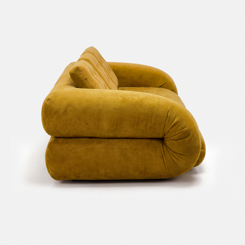 Side view of Tovo Plush Pillow Sleeper Sofa with low wide seat and soft cushions