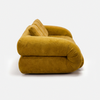 Side view of Tovo Plush Pillow Sleeper Sofa with low wide seat and soft cushions