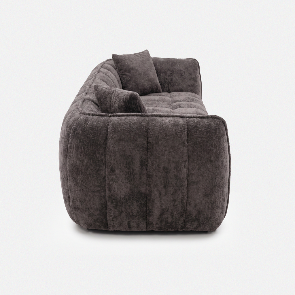 Side view of Melo Charcoal Plush Loveseat with low-profile silhouette