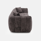 Side view of Melo Charcoal Plush Loveseat with low-profile silhouette