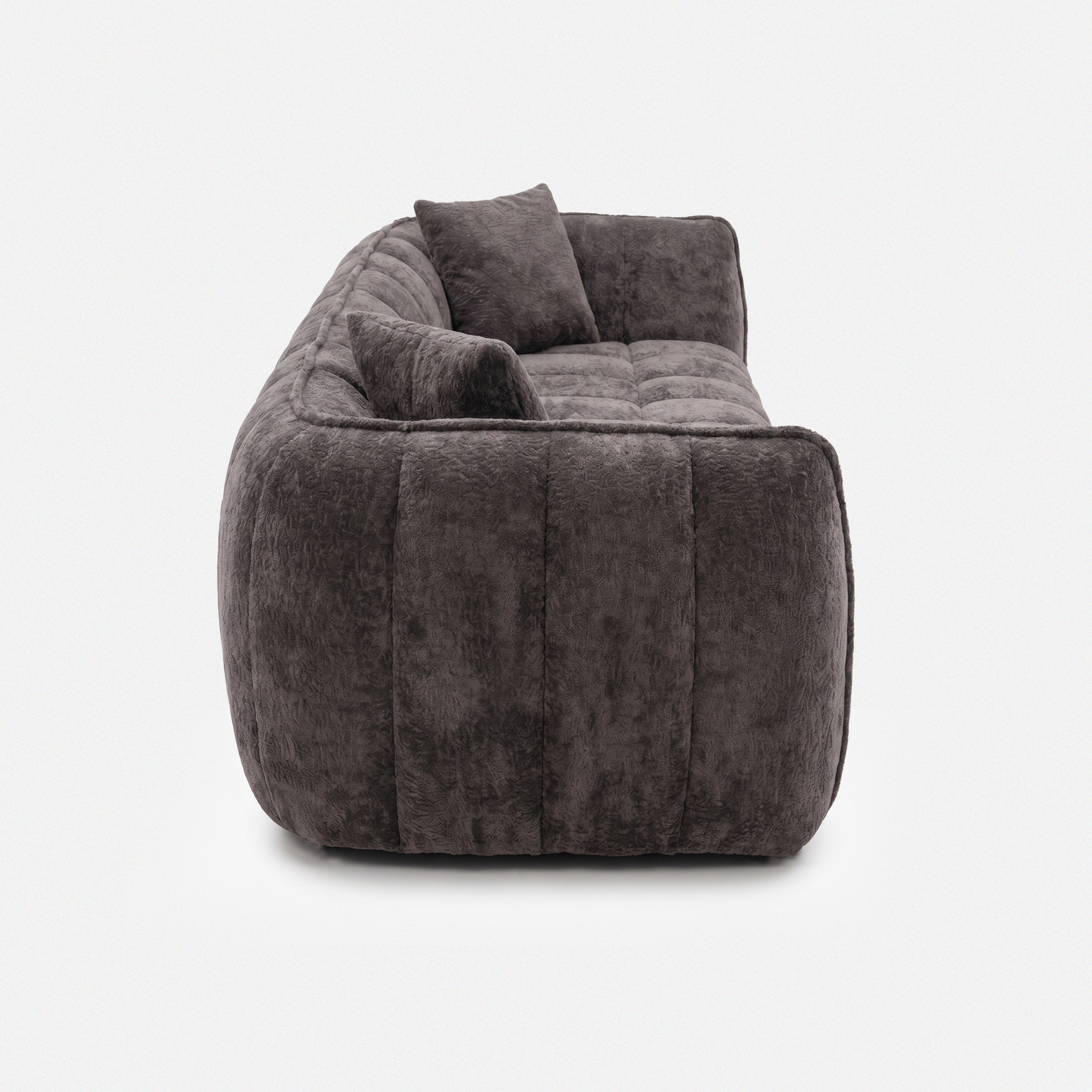 Side view of Melo Charcoal Plush Loveseat with low-profile silhouette
