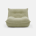 Lune Cream Lounge Chair in Moss with curved lounge design and plush corduroy texture